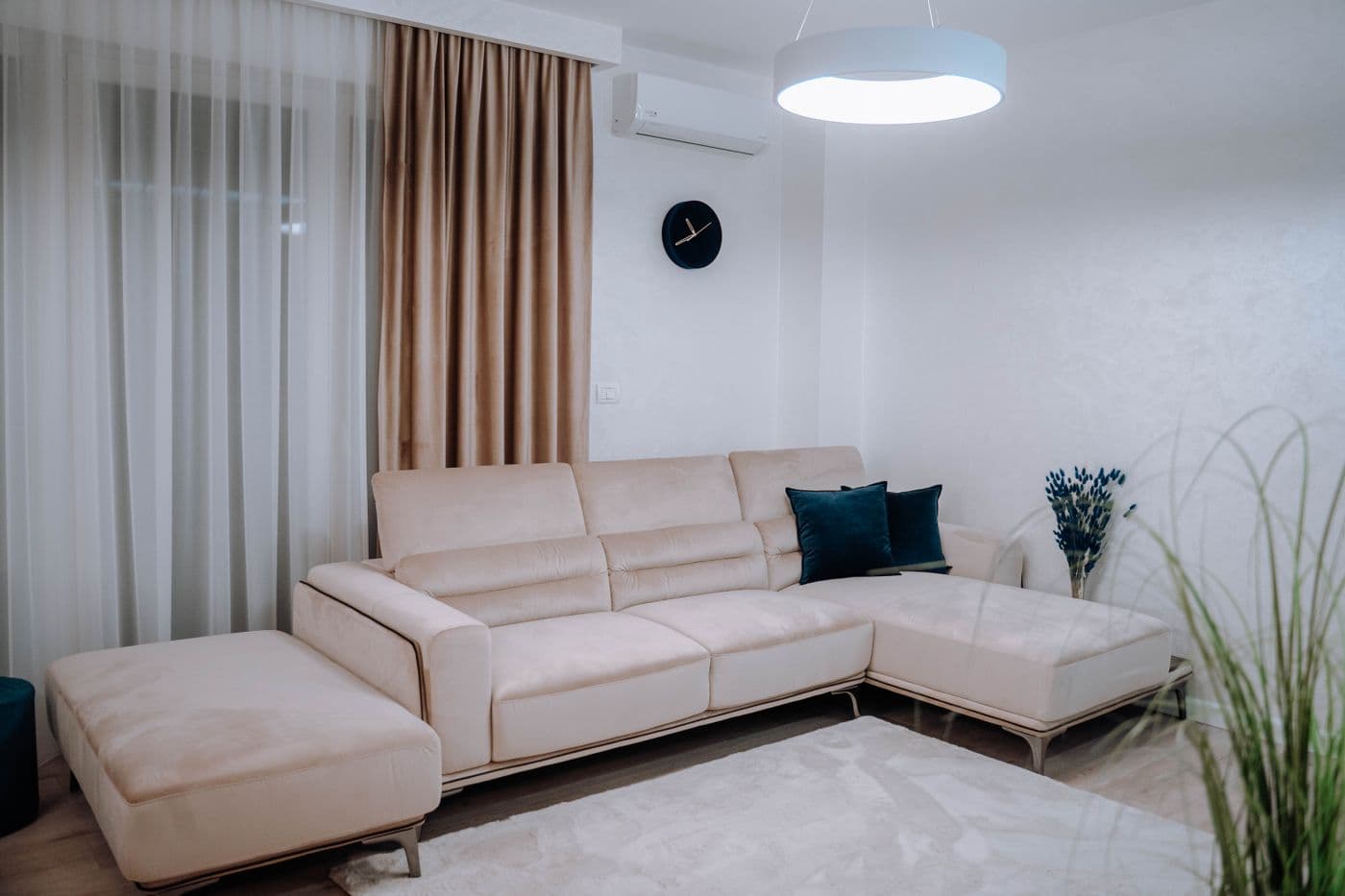 A light, inviting living room with neutral furniture